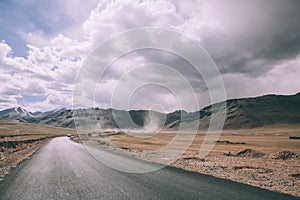 empty asphalt road in mountain valley and cloudy sky in Indian Himalayas,