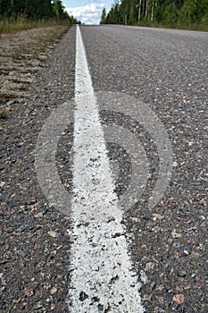 Empty asphalt road in rural landscape, Finland