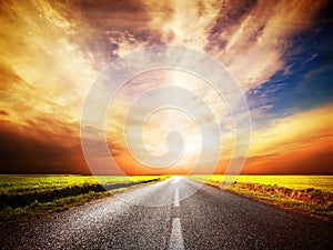 Empty asphalt road. Sunset Sky