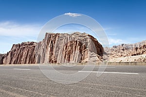 Empty asphalt road with xinjiang geological landscape photo