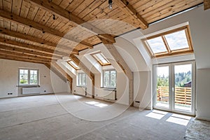 Empty attic rooms after ceiling and wall work photo