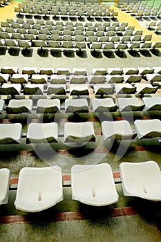 Empty audience white seats at soccer stadium