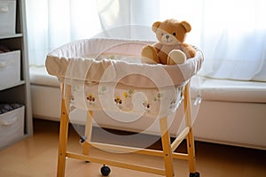 an empty baby bassinet with a soft plush toy