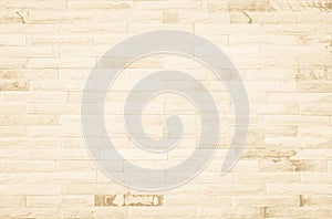 Empty background of wide cream brick wall texture. Beige old brown brick wall concrete or stone textured, wallpaper limestone