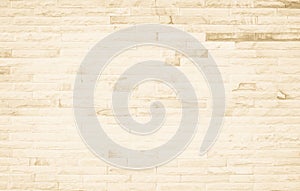 Empty background of wide cream brick wall texture. Beige old brown brick wall concrete or stone textured, wallpaper limestone