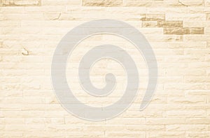 Empty background of wide cream brick wall texture. Beige old brown brick wall concrete or stone textured, wallpaper limestone