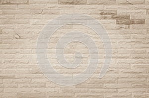 Empty background of wide cream brick wall texture. Beige old brown brick wall concrete or stone textured, wallpaper limestone