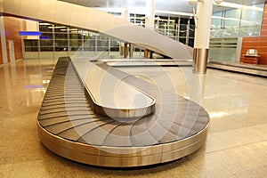 Empty baggage carousel in airport hall photo