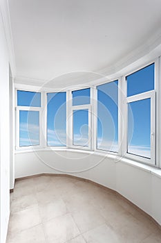 Empty balcony of modern apartment with panoramic windows