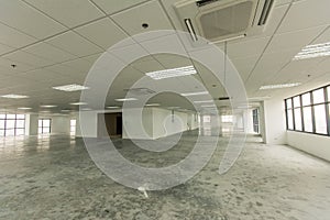 Empty and bare floor plate. Office interior of a building, Concept of bankruptcy or closure.
