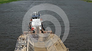 Empty barge on river on summer warm day