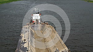 Empty barge on river on summer warm day