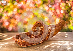 Empty basket for fruits and vegetables on an autumn sunny background with beautiful bokeh