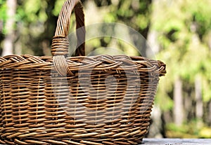 Empty basket picnic on table place. Natural rustic background