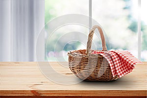 Empty basket with red napkin picnic on table place. Spring background