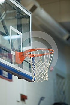 Empty basketball goal in gym