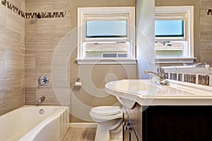 Empty bathroom interior with tile wall trim in soft beige color