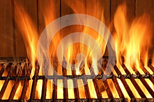 Empty BBQ Flaming Grill And Wood Wall In The Background