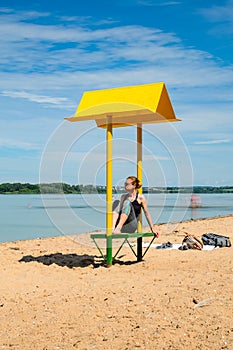 Empty beach with a bench with a canopy on the coast