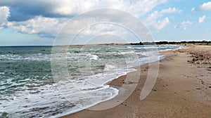 Empty beach of the black sea, heavy clouds and soon the storm