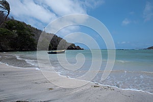 Empty beach with a boat