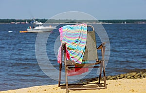 An empty beach chair at the beach family vacation