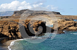 Empty beach by the cliff