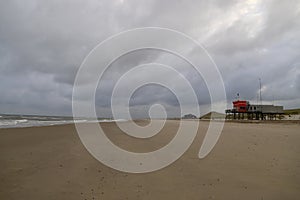 empty beach on a cloudy day in the quiet coastal small town, the Netherlands.