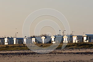 Empty beach holiday homes. Seaside vacation chalet lodges winter UK