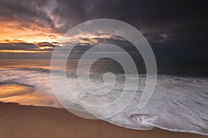 Empty beach at sunset
