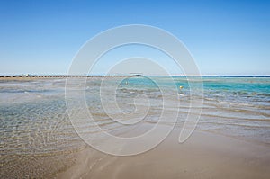 Empty beach on the sea and sunny sky/Empty summer beach on the sea and sunny sky