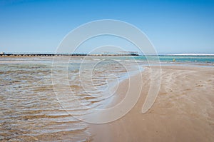 Empty beach on the sea and sunny sky/Empty summer beach on the sea and sunny sky