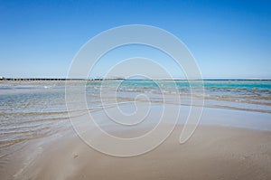 Empty beach on the sea and sunny sky/Empty summer beach on the sea and sunny sky