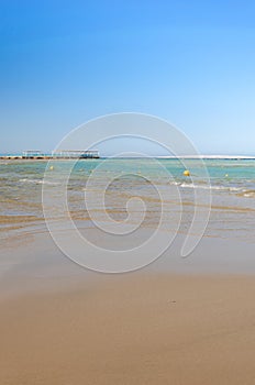 Empty beach on the sea and sunny sky/Empty summer beach on the sea and sunny sky