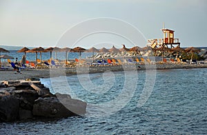 Empty beach with sunbeds