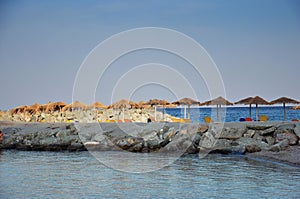 Empty beach with sunbeds