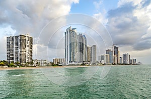 Empty beach at Sunny isles beach, Miami in early morning with skyscraper