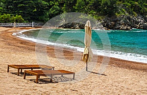 Empty beach with two chairs, Queen`s Beach, Montenegro