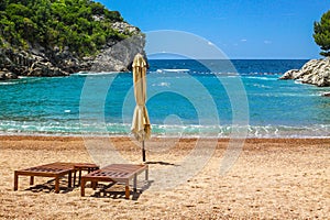 Empty beach with two chairs, Queen`s Beach, Montenegro