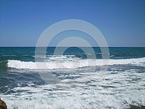 an empty beach with waves