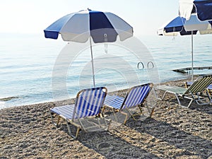 Empty beaches, sun loungers and beach umbrellas wait tourists, Corfu, Greece, tourism problems after the coronavirus pandemic