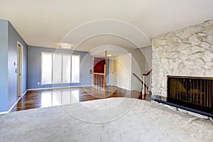 Empty beautiful living room with a fireplace