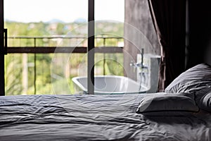 Empty bed in apartment bedroom