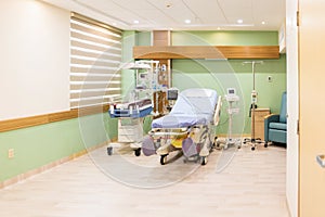 Empty bed in maternity ward at a hospital photo
