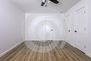 Empty bedroom with open doors