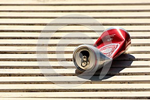 Empty beer can on a bench in a park, Warsaw, Poland