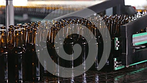 Empty beer glass bottles on the conveyor belt.