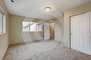 Empty beige bedroom interior of new contemporary home