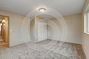 Empty beige bedroom interior of new contemporary home