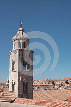 Empty bell tower  and red roof tiles of Dubrovnik Old town during corona virus